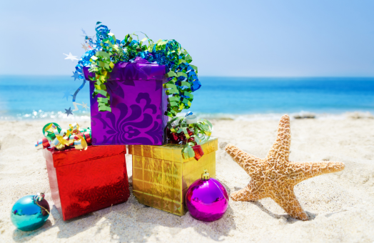brightly wrapped gift boxes on the beach